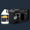 Hazer machine (Amhaze ECO) with a bottle of Chauvet haze fluid placed beside it.